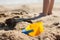 Baby bucket on a sandy beach in the background