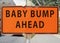 BABY BUMP AHEAD road sign.