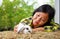 A baby bunny was being take care by a farmer on farm