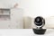 Baby camera on table in room, space for . Video nanny