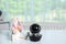 Baby camera with toy on table in room. Video nanny