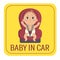 Baby in car sign. Boy fastened in car chair