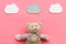 Baby care. Newborn baby concept. Baby sleep concept. Teddy bear toy near clouds on pink background top view space for