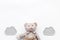 Baby care. Newborn baby concept. Baby sleep concept. Teddy bear toy near clouds on white background top view copy space
