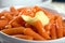 Baby carrots with butter close-up