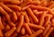 Baby carrots texture background, top view