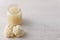 Baby cauliflower puree in glass jar on white background