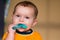 Baby chewing on teething ring