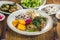 A baby chicken called galeto in Brazil served with herbs, potato salad, wine onion, fried polenta, rice with dried meat and potato