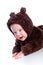 Baby child in teddy-bear costume