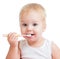 Baby cleaning teeth and smiling