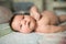 Baby close up. lying on the couch in the parent room. picture of a newborn baby curled up sleeping on a blanket