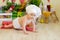 A baby in a cook`s hat sits in a beautiful photo zone with flour and vegetables, a baby cook, a child with flour and bread