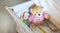 Baby cot with cute soft cuddly toys and white blanket