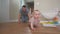 baby crawl first steps. dad play a baby toddler take crawl at home. happy family kid dream concept. baby son learning to