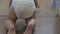 Baby crawls on all fours in a diaper