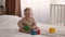 Baby Development. Cute Infant Child Playing With Colorful Building Blocks On Bed