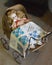 Baby Doll in Old Fashioned Carriage with Quilt