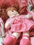 Baby doll in a pink dress, cute pinky rag baby doll