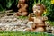 Baby dolls made of clay, used for garden decoration.