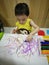 A baby drawing his first piece