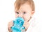 Baby drinking water from a canteen with handles