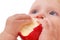 Baby eating apple