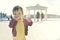 A baby eating biscuit on the background of nature. Child near the lake.