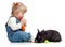 Baby eating a carrot and feeding rabbit