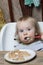 Baby eats porridge spoon mashed