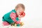 Baby in elf costume grabbing christmas ballself, costume, dress, white, background, studio, baby, toddler, balls, xmas, christmas