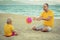 Baby and father playing toy ball