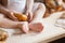 Baby feet in flour, buns, bread, bagels, kitchen still life