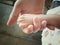 baby feet in mother hands close up with soft focus and vintage tone