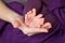 Baby feet in mother hands. Tiny Newborn Baby\'s feet on female Shaped hands closeup.