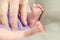 Baby feet and mother`s hand