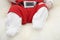 Baby feet in Santa Claus costume