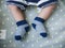 Baby feets in blue socks. keep baby feet warm