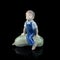 Baby figurine on a black background. Baby figurine on a black background.