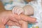 Baby fingers in father\'s Hands