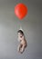 Baby float with a red balloon