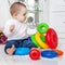 The baby is fond of toys at home. The concept of childhood devel