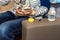 Baby food bottle with milk formula on side of the couch prepared by mother