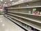 A baby formula display sits empty at supermarket as a result of nationwide baby formula shortage