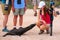 Baby Galapagos sea lion looking at young woman on North Seymour