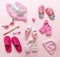 Baby girl accesories on pink background baby shower concept