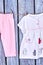 Baby-girl apparel on clothesline.