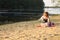 Baby girl beach playing alone sand spring clothes
