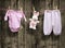 Baby girl clothes and bunny on a clothesline