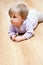 Baby girl crawling on floor